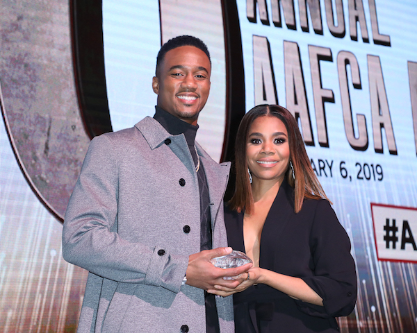 Jessie T. Usher (SHAFT) presented his onscreen mom Regina Hall with the best actress award for her performance in SUPPORT THE GIRLS at the 10th Annual AAFCA Awards