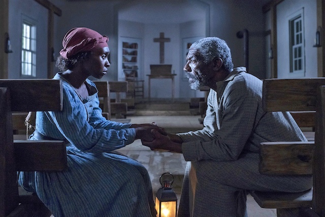 Cynthia Erivo stars as Harriet Tubman and Vondie Curtis-Hall as Reverend Green in HARRIET