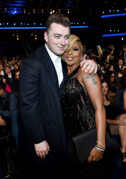 Singer and songwriter Sam Smith (L) and Mary J Blige