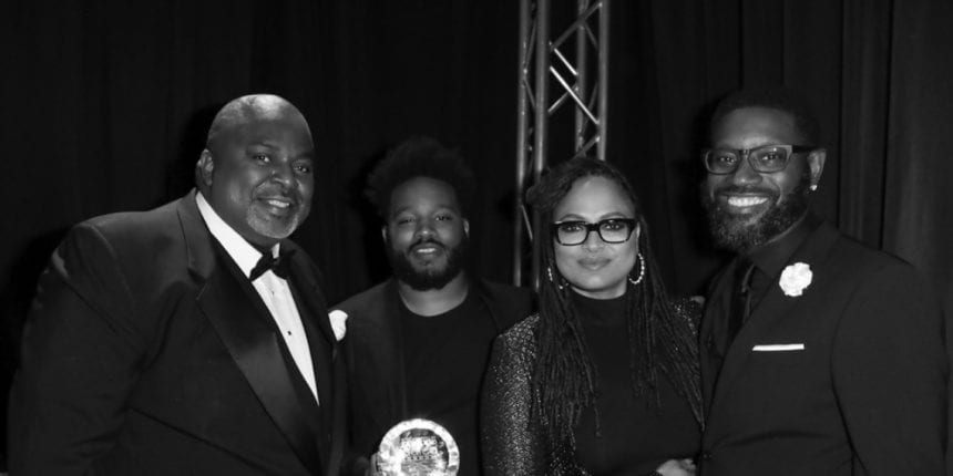 AAFCA co-founder and president Gil Robertson (L), Black Panther director Ryan Coogler, filmmaker Ava DuVernay, AAFCA co-founder Shawn Edwards (R) backstage at the 10th Annual AAFCA Awards